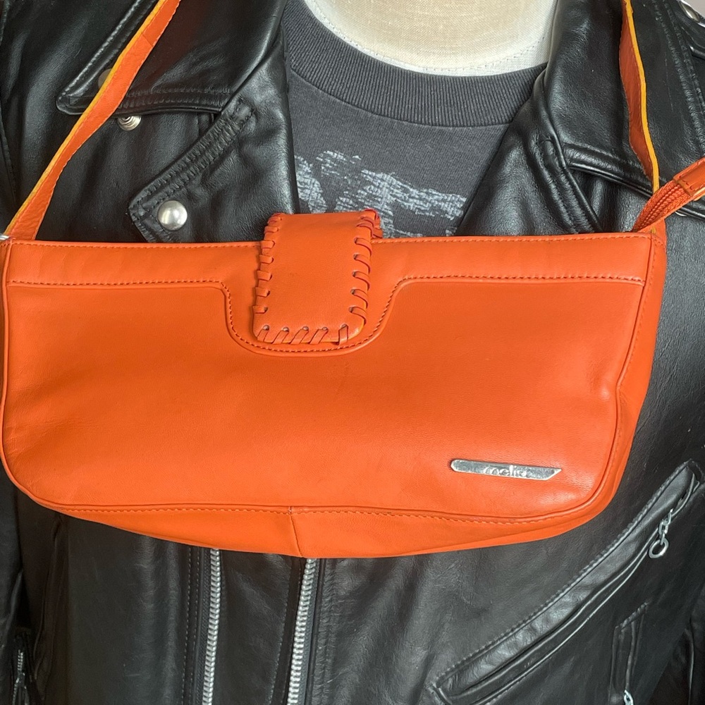 Orange Vera Pelle handbag.